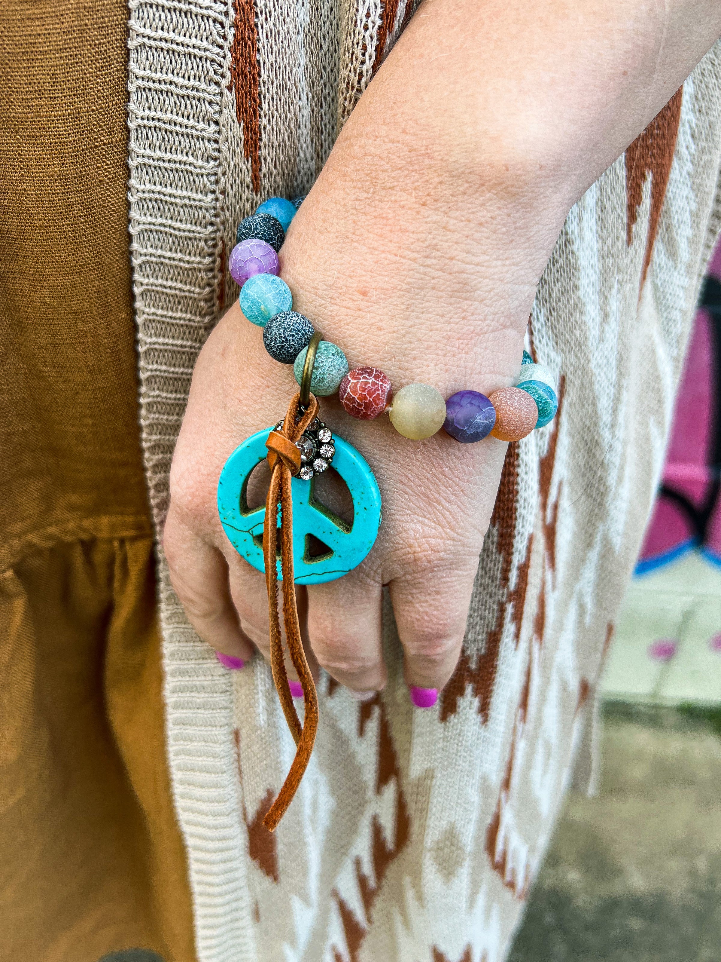 Premium Photo | Red hippie bracelet on stones